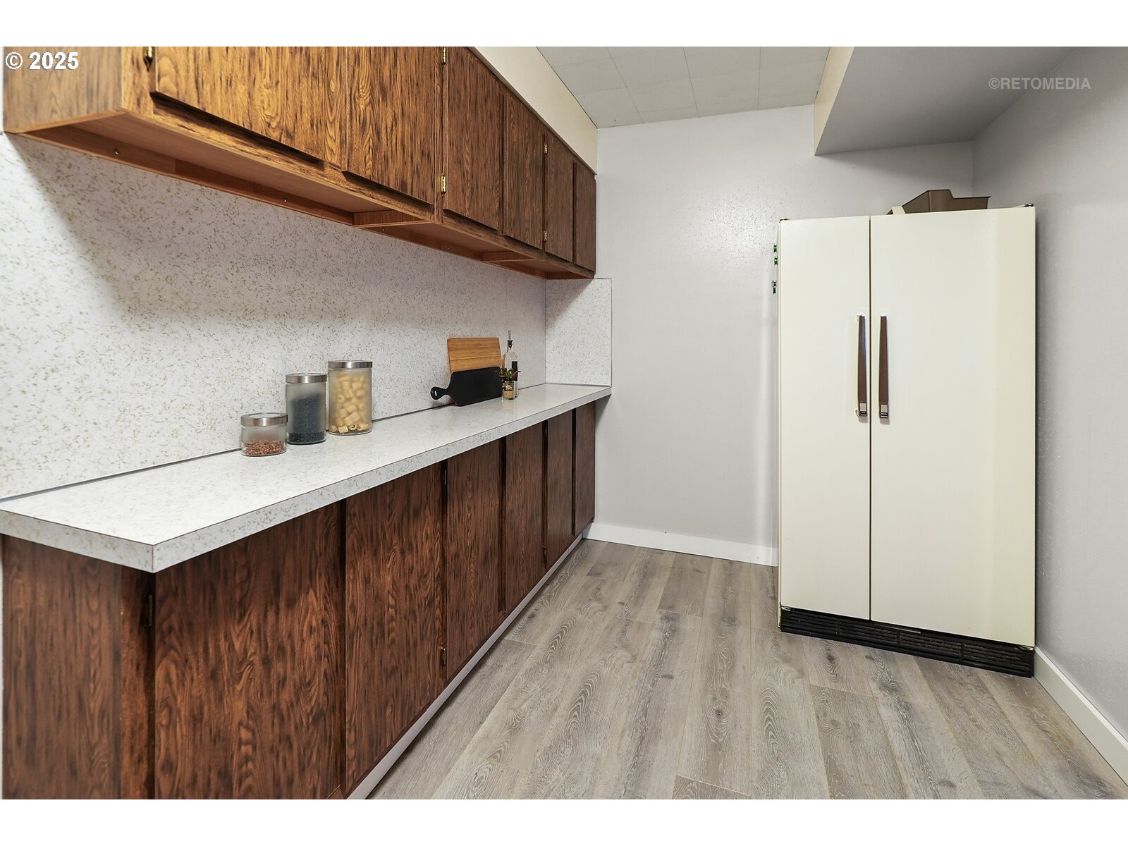 57647 Cedar Springs Drive Scappoose, OR 97056 - Photo 32 of 48 a kitchen with cabinets and wooden floor