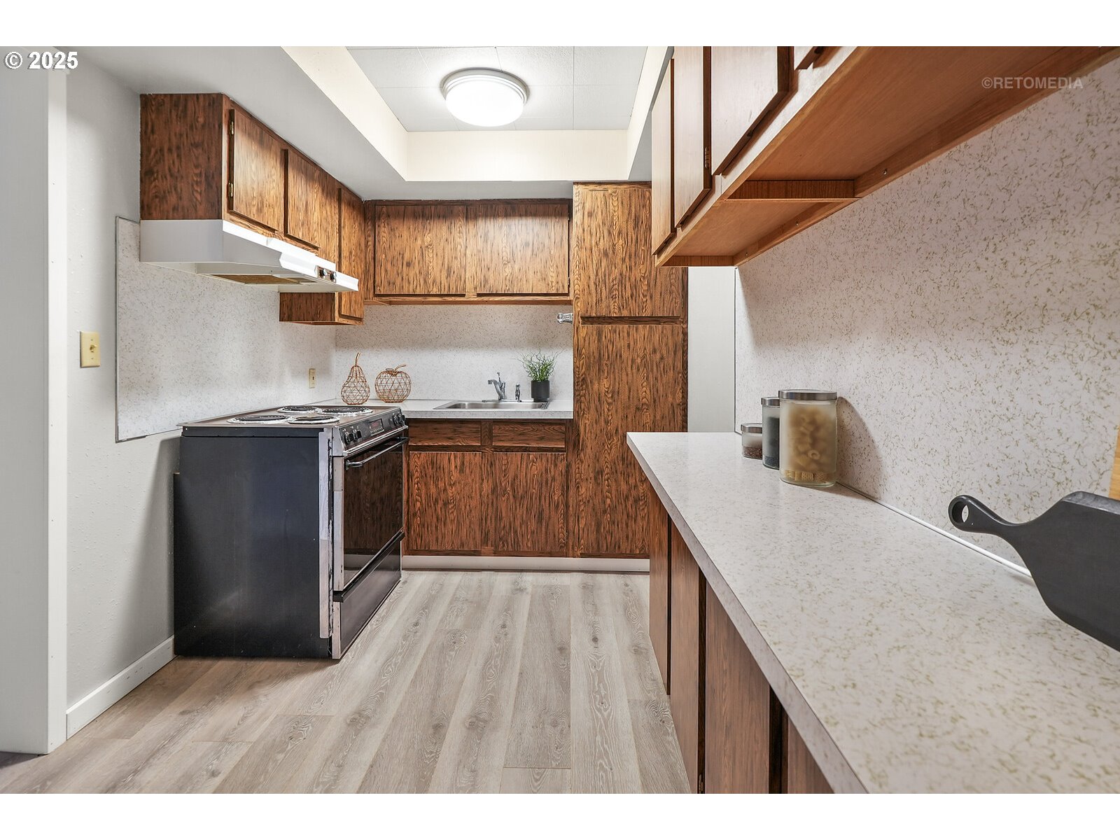 57647 Cedar Springs Drive Scappoose, OR 97056 - Photo 33 of 48 a kitchen with a sink a cabinets and wooden floor