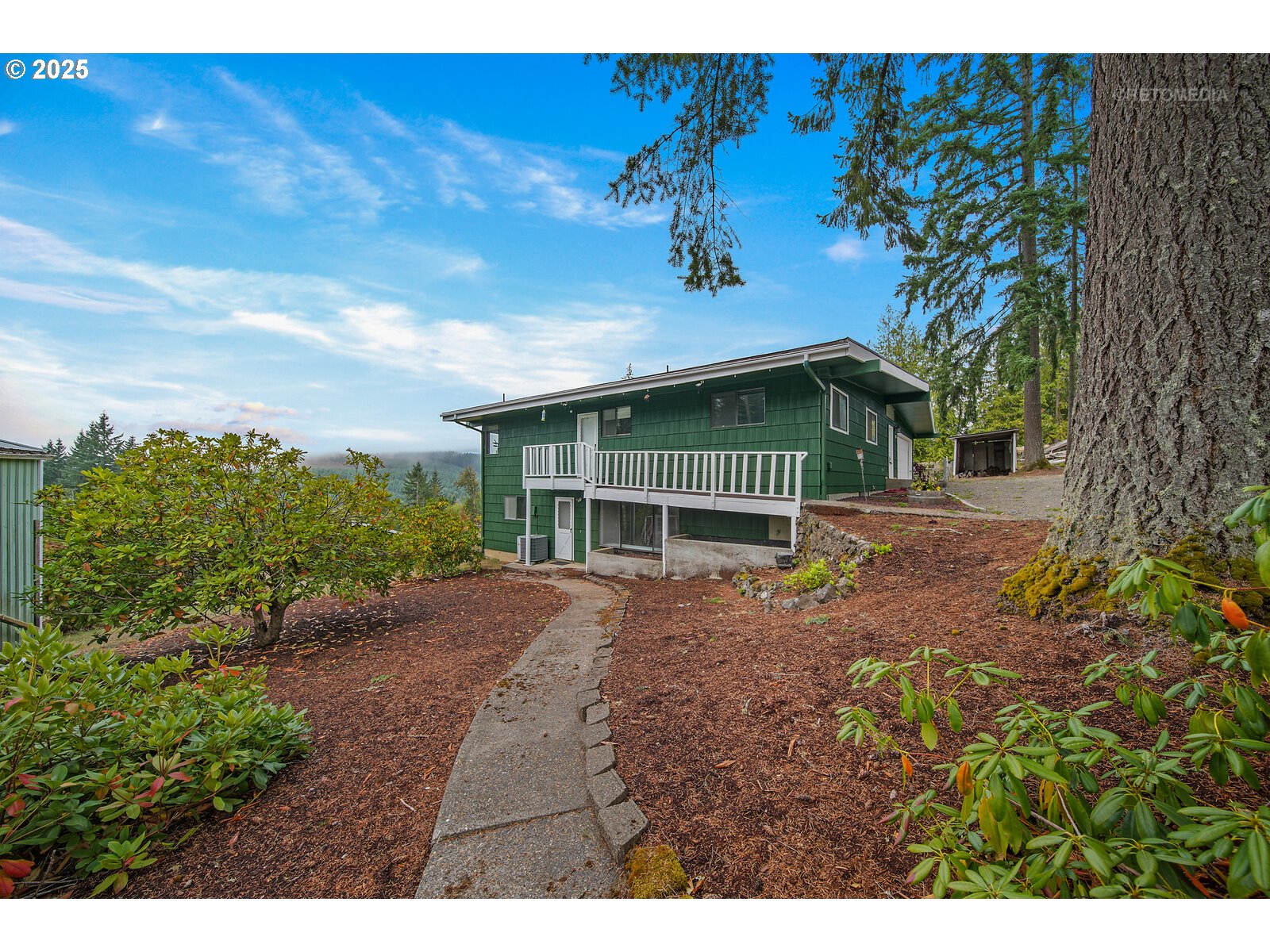 57647 Cedar Springs Drive Scappoose, OR 97056 - Photo 5 of 48 a view of a house with a garden