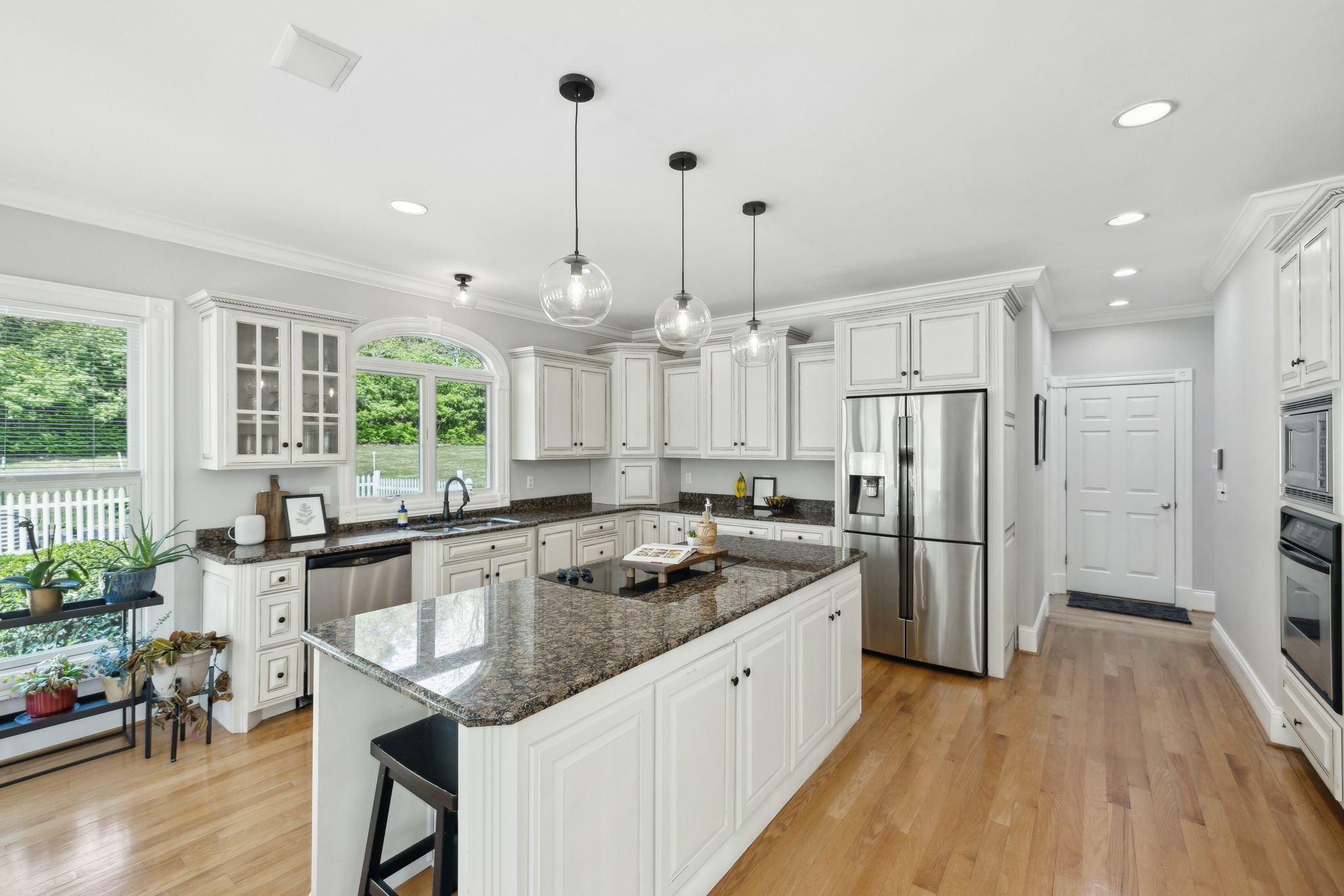 1546 Hudson Road Madison, TN 37115 - Photo 13 of 77 a kitchen with refrigerator cabinets and wooden floor