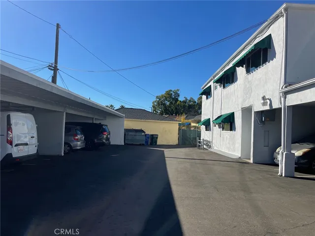 a view of a chairs and table in backyard