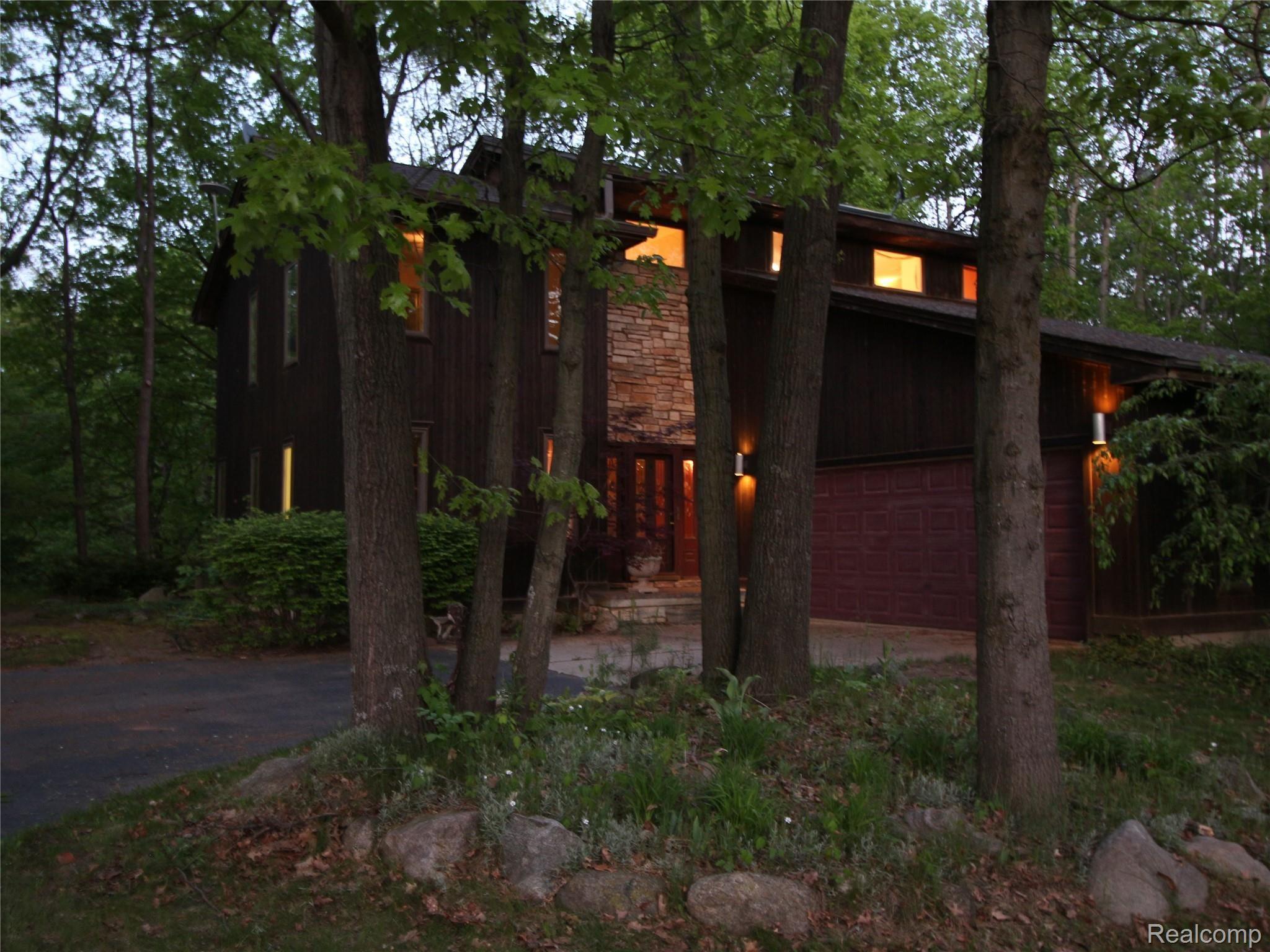 3145 Levalley Road Columbiaville, MI 48421 - Photo 16 of 79 Front through the tree's at night.JPG