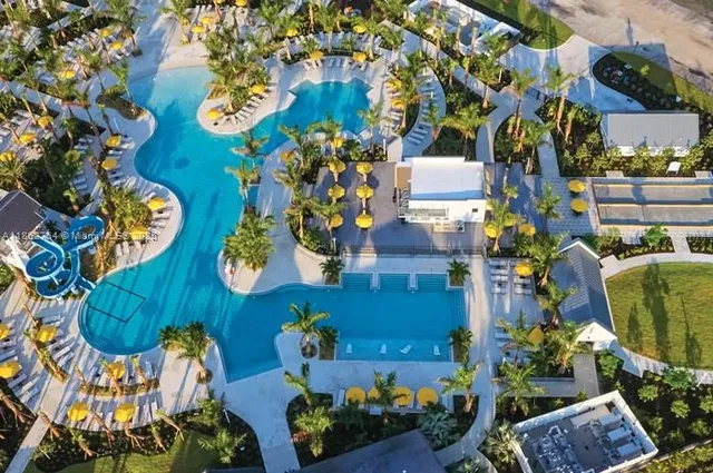 an aerial view of a house a swimming pool and outdoor space