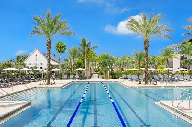 a view of swimming pool with outdoor seating