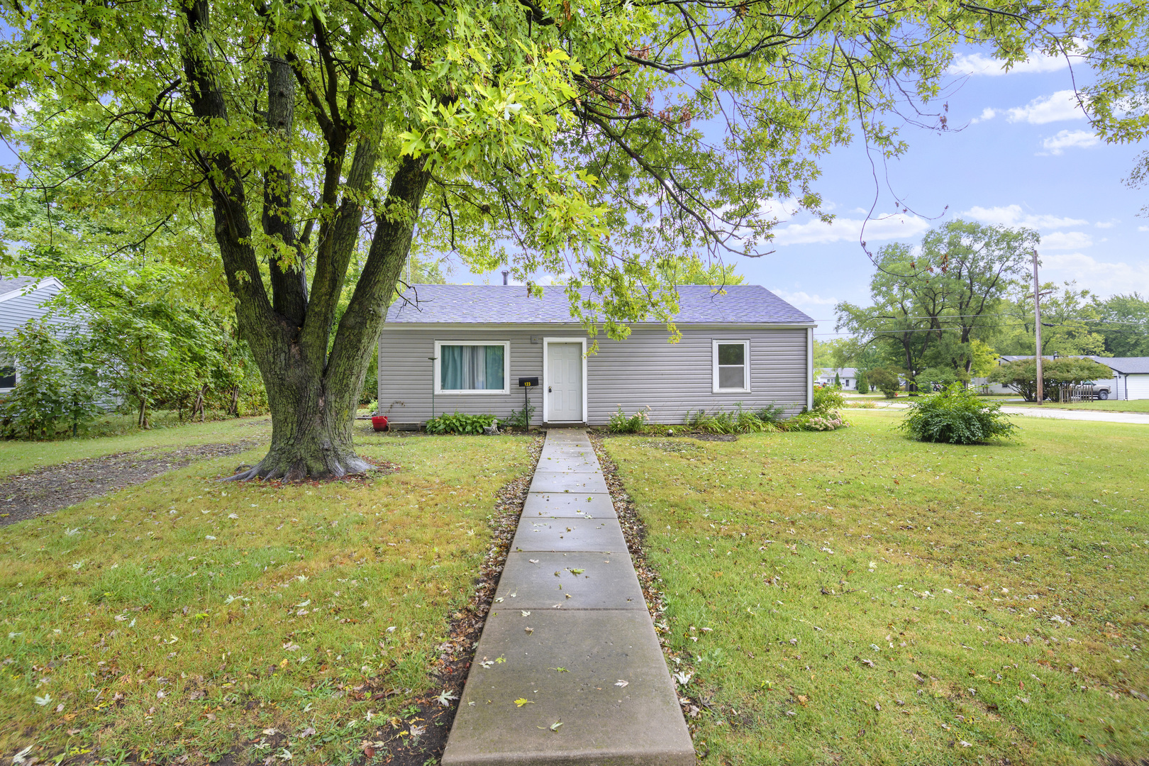 123 Luana Road Joliet, IL 60433 - Photo 1 of 16 a front view of a house with yard