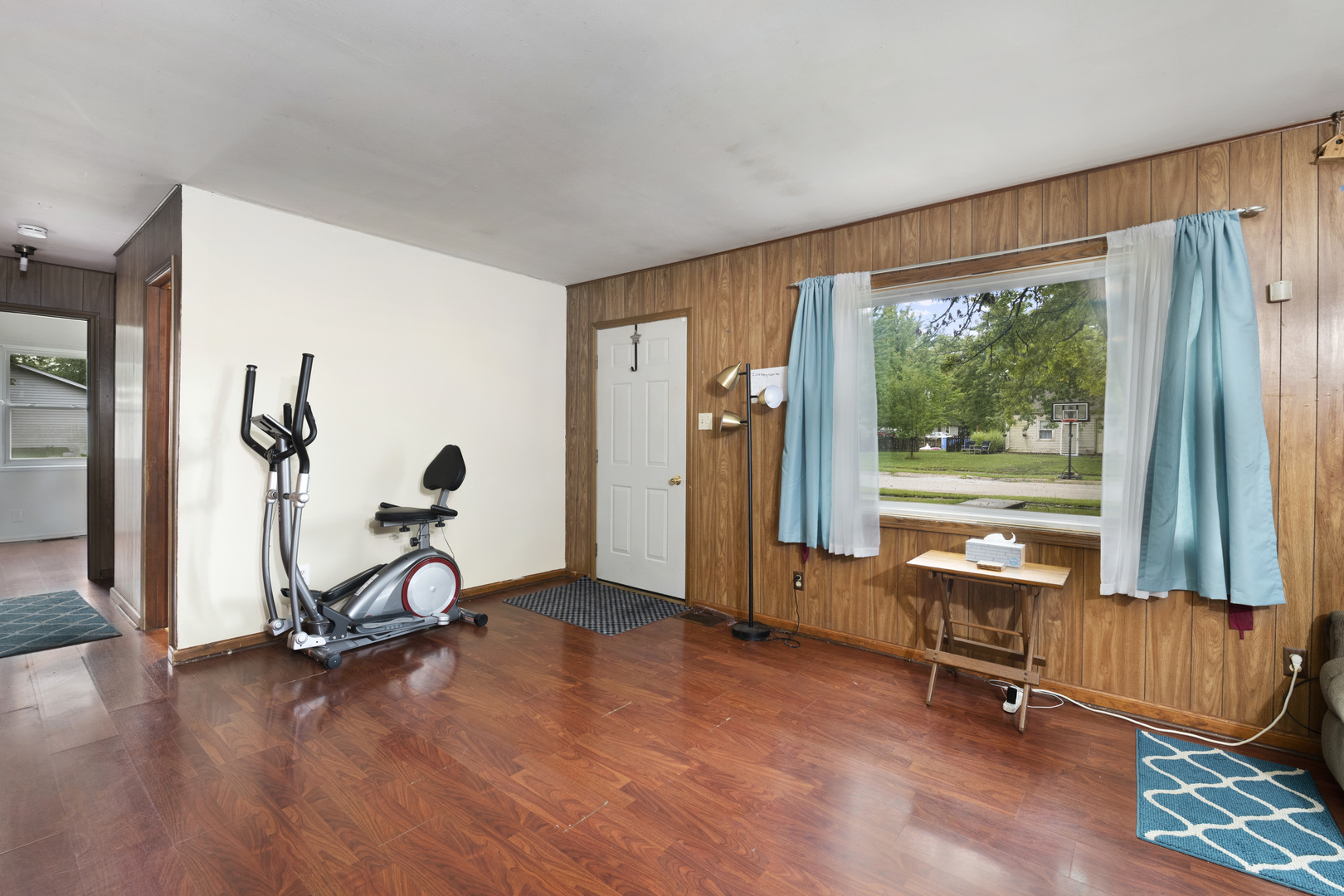 123 Luana Road Joliet, IL 60433 - Photo 10 of 16 a view of a room with gym equipment and a large window
