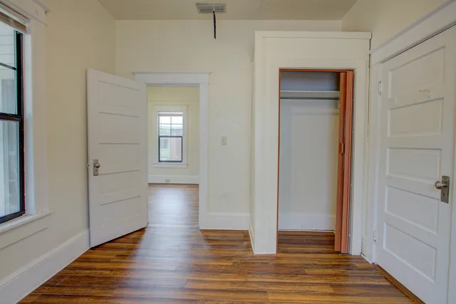 a view of livingroom with hardwood floor and hallway