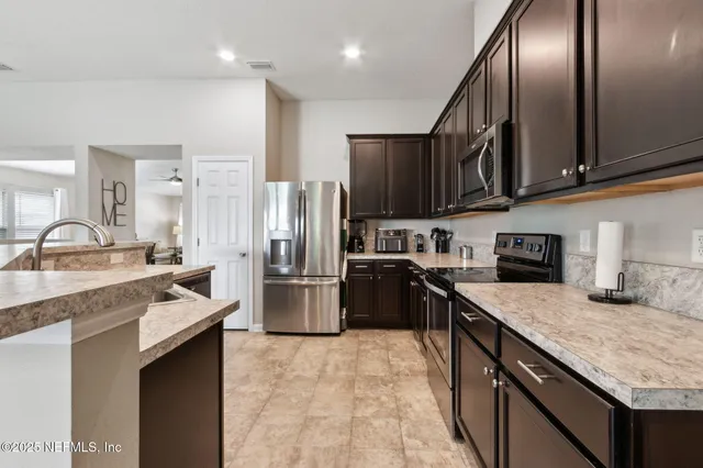 a house with swimming pool in front of it