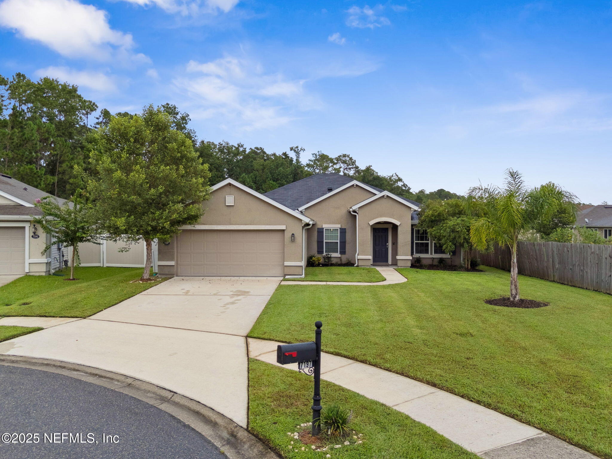 7197 Steventon Way Jacksonville, FL 32244 - Photo 2 of 58 a front view of a house with garden