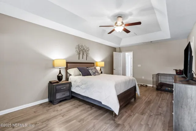 a living room with hardwood floor and balcony