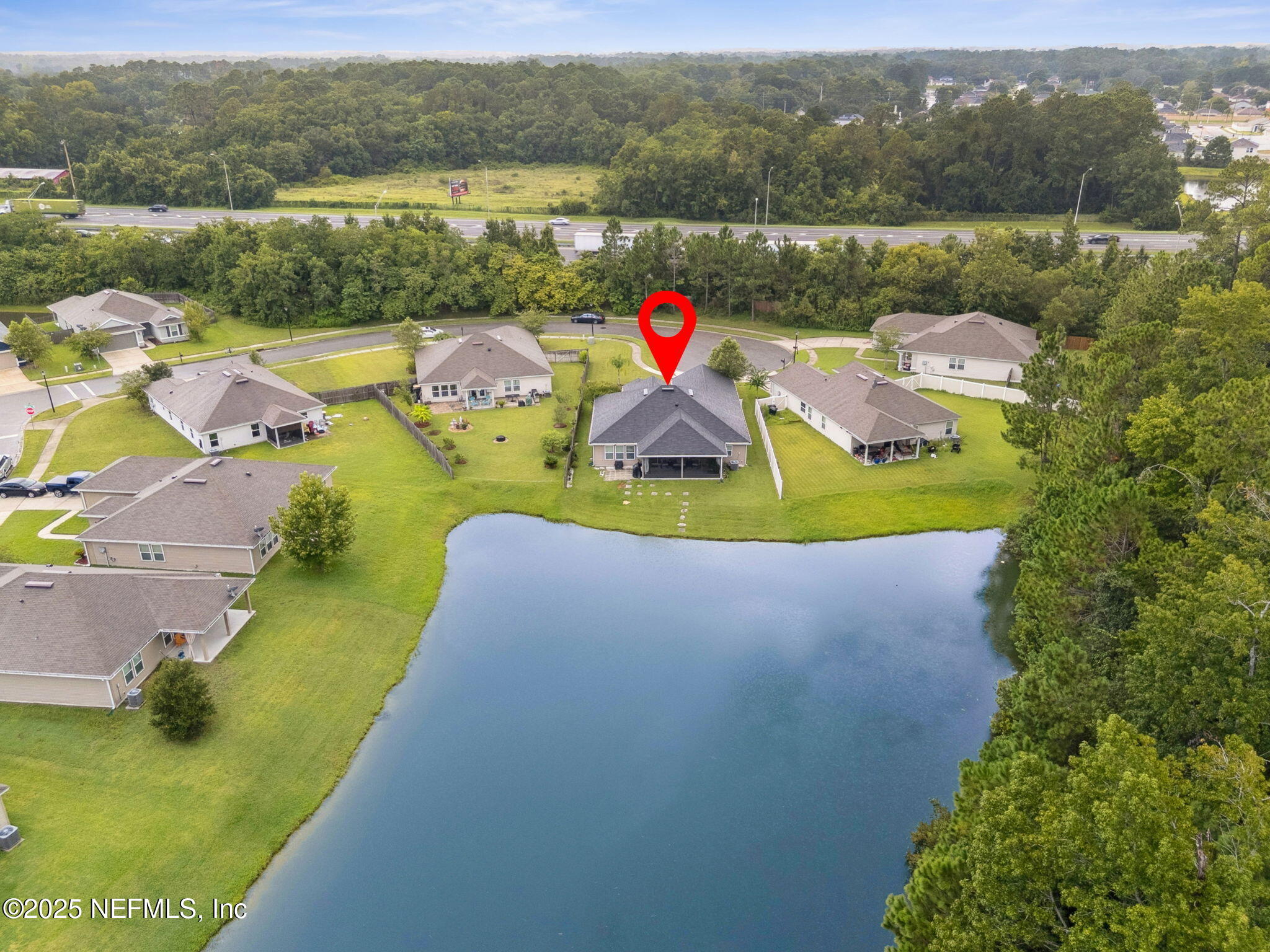 7197 Steventon Way Jacksonville, FL 32244 - Photo 57 of 58 a view of a lake with a yard