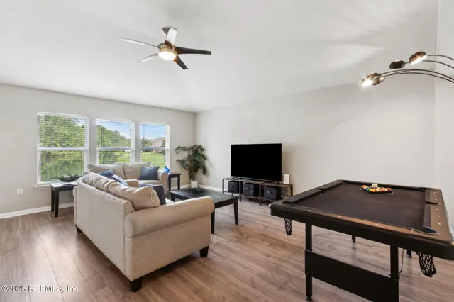 a work room with furniture and a window