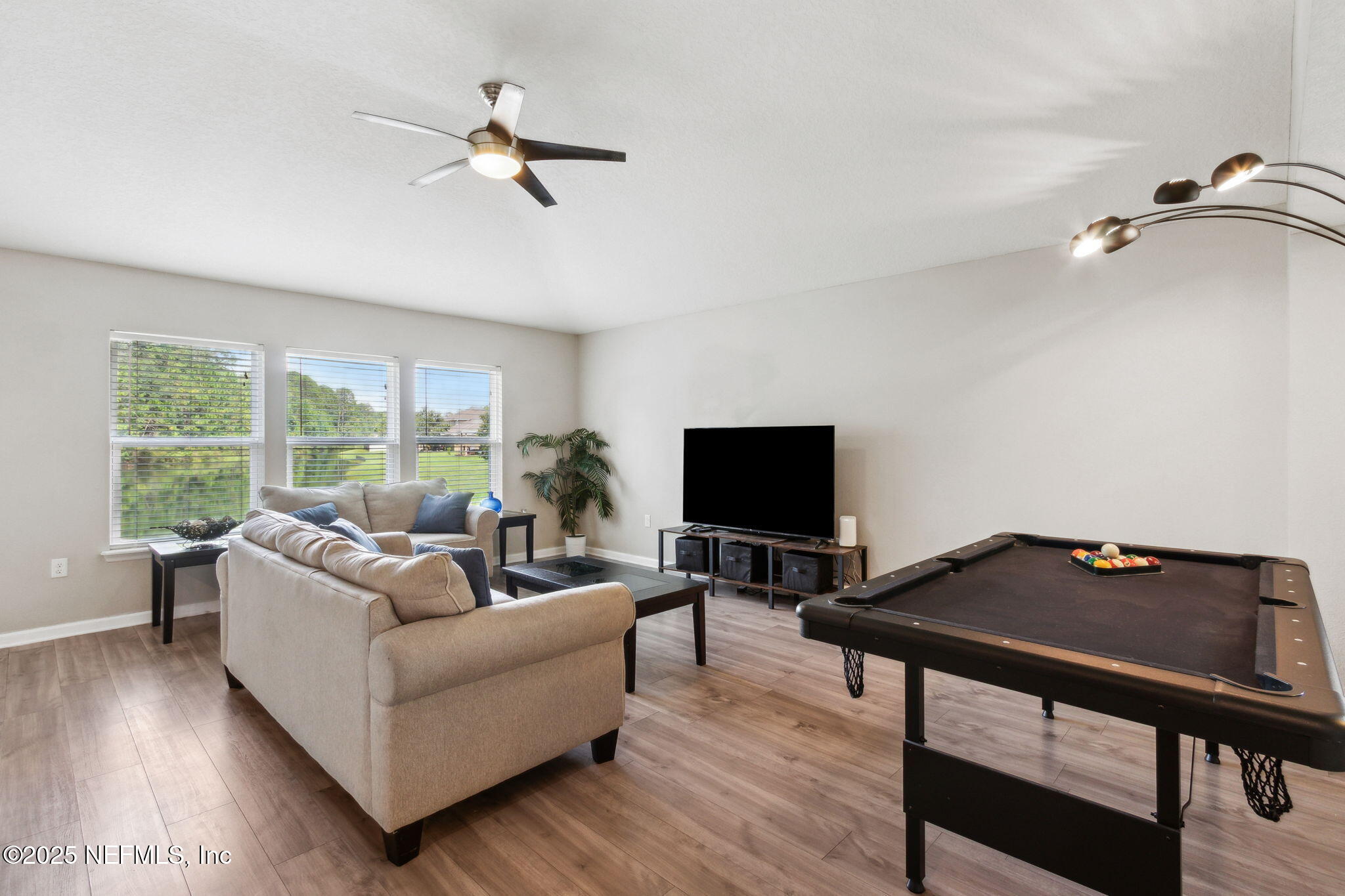7197 Steventon Way Jacksonville, FL 32244 - Photo 8 of 58 a living room with furniture and a flat screen tv