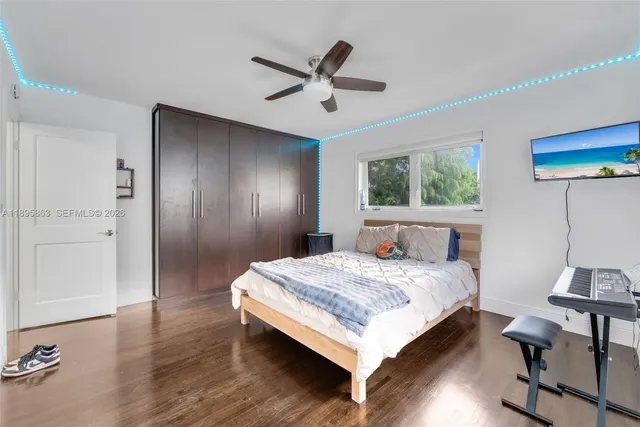 a bedroom with a bed and a table in it