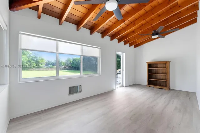a view of room with furniture and window