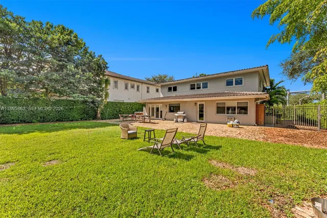 a view of a house with a yard porch and sitting area