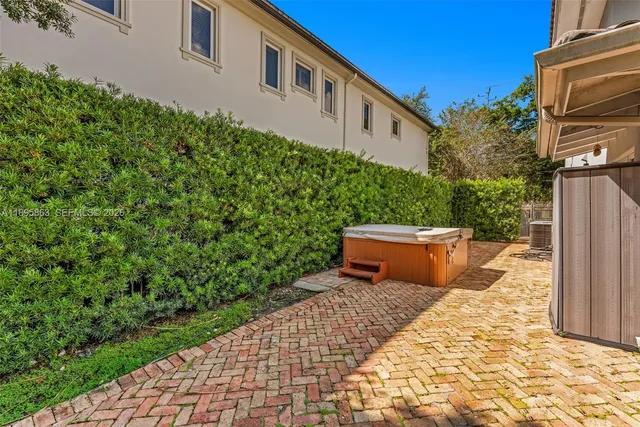 a view of a backyard with sitting area