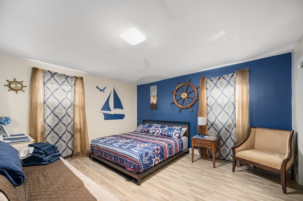 67 Ridge Street Providence, RI 02909 - Photo 21 of 42 a bedroom with a bed and wooden floor