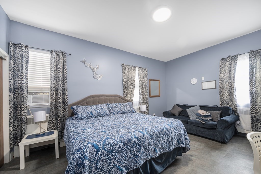 67 Ridge Street Providence, RI 02909 - Photo 29 of 42 a bedroom with a bed and a couch