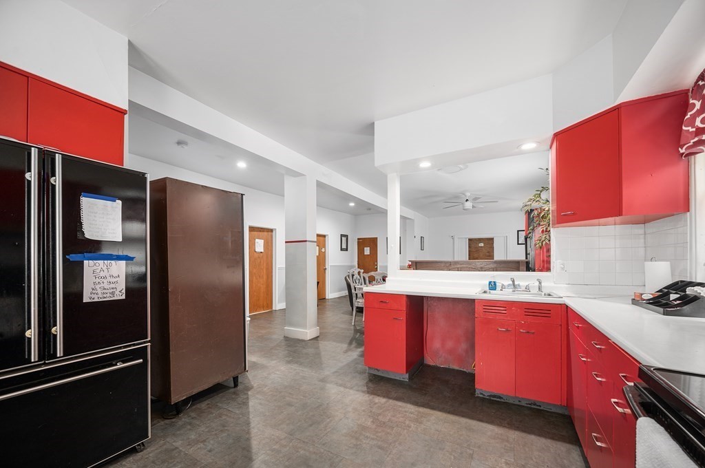 67 Ridge Street Providence, RI 02909 - Photo 9 of 42 a kitchen with stainless steel appliances granite countertop a refrigerator and a stove