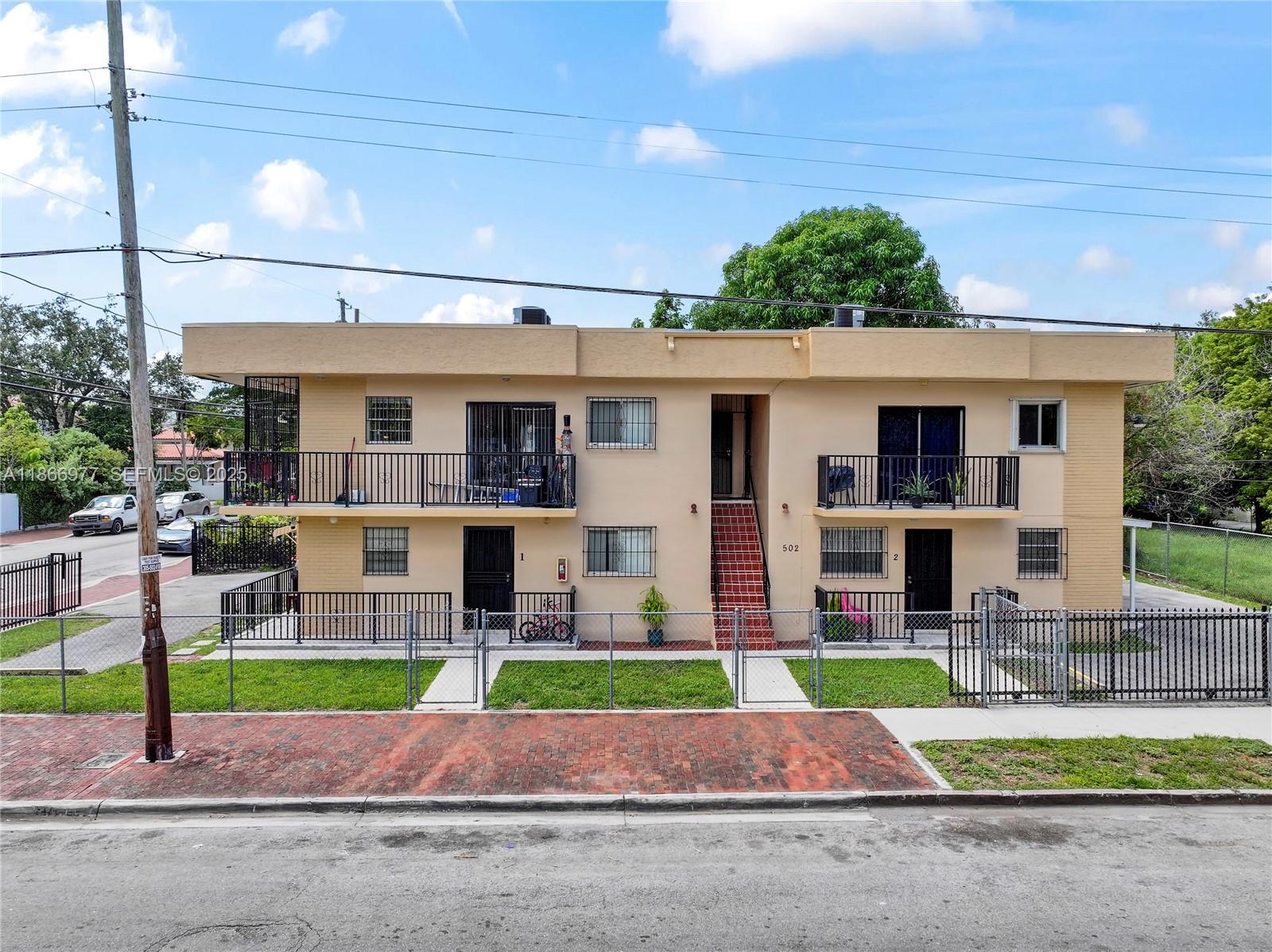 502 Southwest 13th Avenue Miami, FL 33135 - Photo 1 of 48 a front view of house with yard and green space