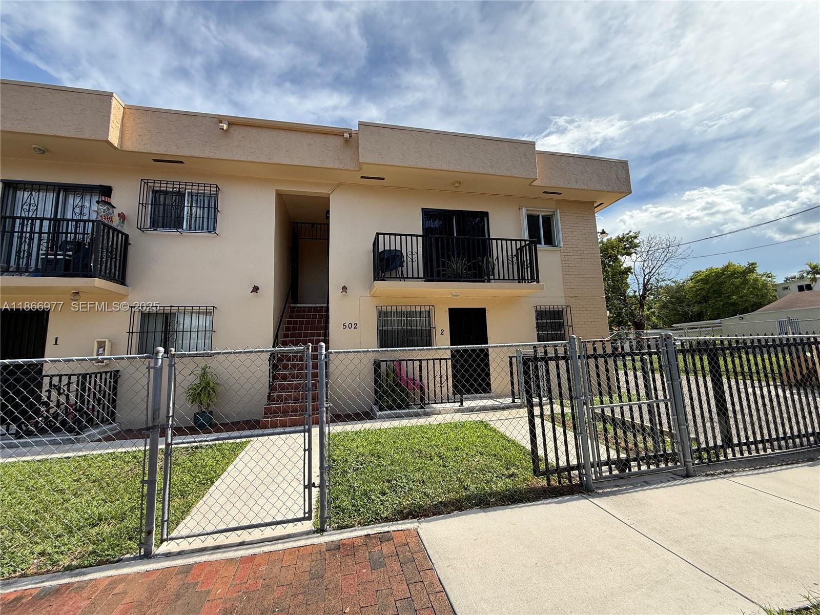 502 Southwest 13th Avenue Miami, FL 33135 - Photo 18 of 48 a front view of a house with a yard
