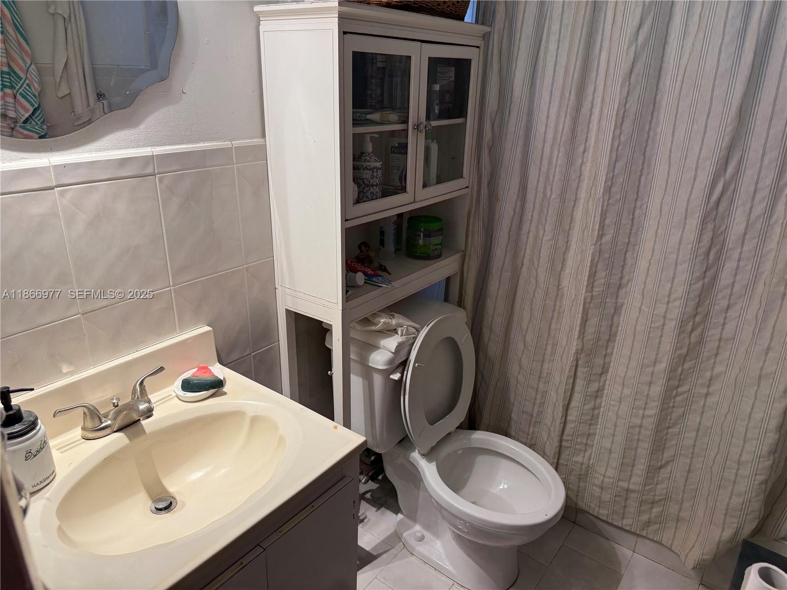 502 Southwest 13th Avenue Miami, FL 33135 - Photo 22 of 48 a bathroom with a sink toilet and shower