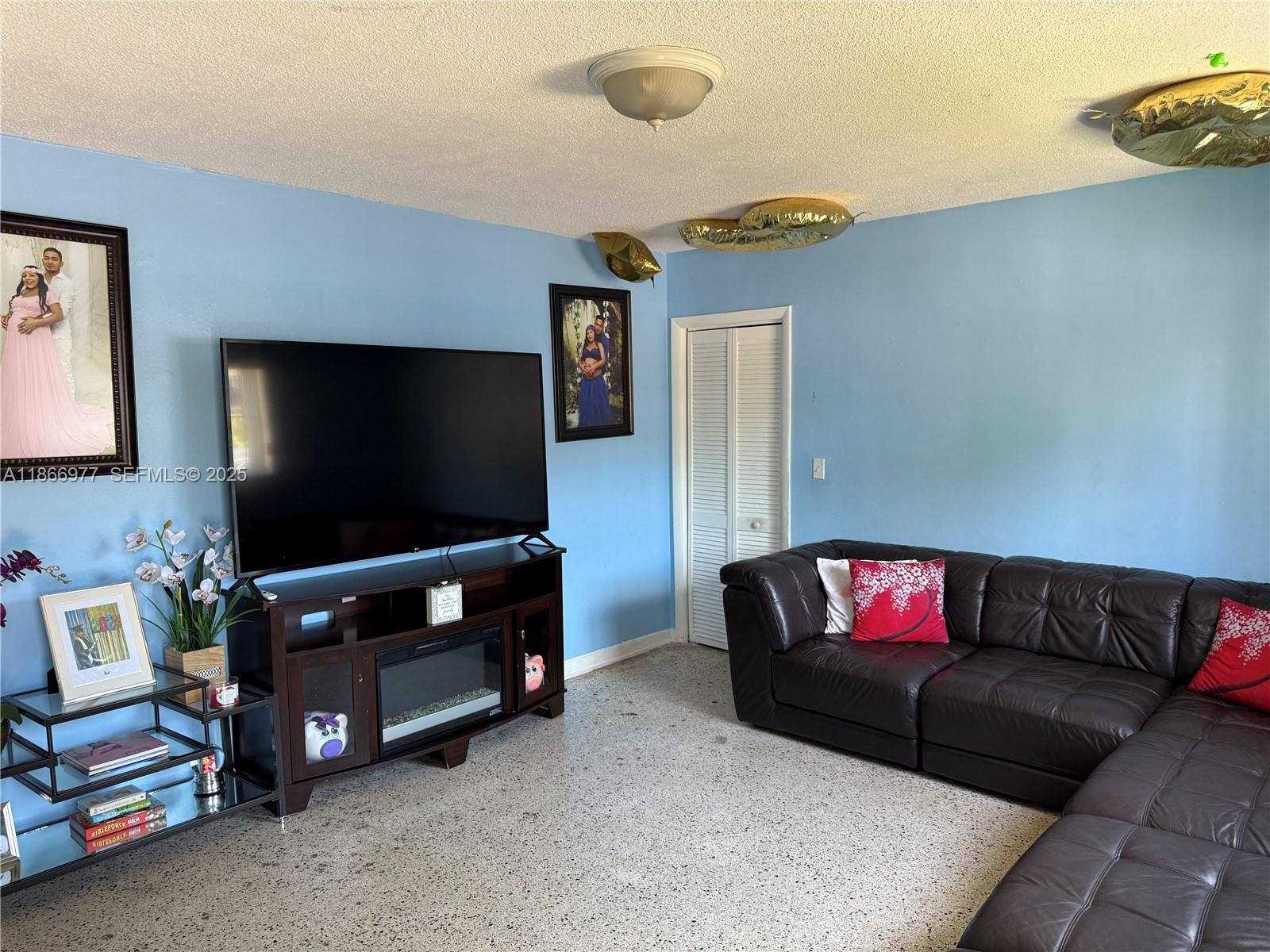 502 Southwest 13th Avenue Miami, FL 33135 - Photo 23 of 48 a living room with furniture and a flat screen tv