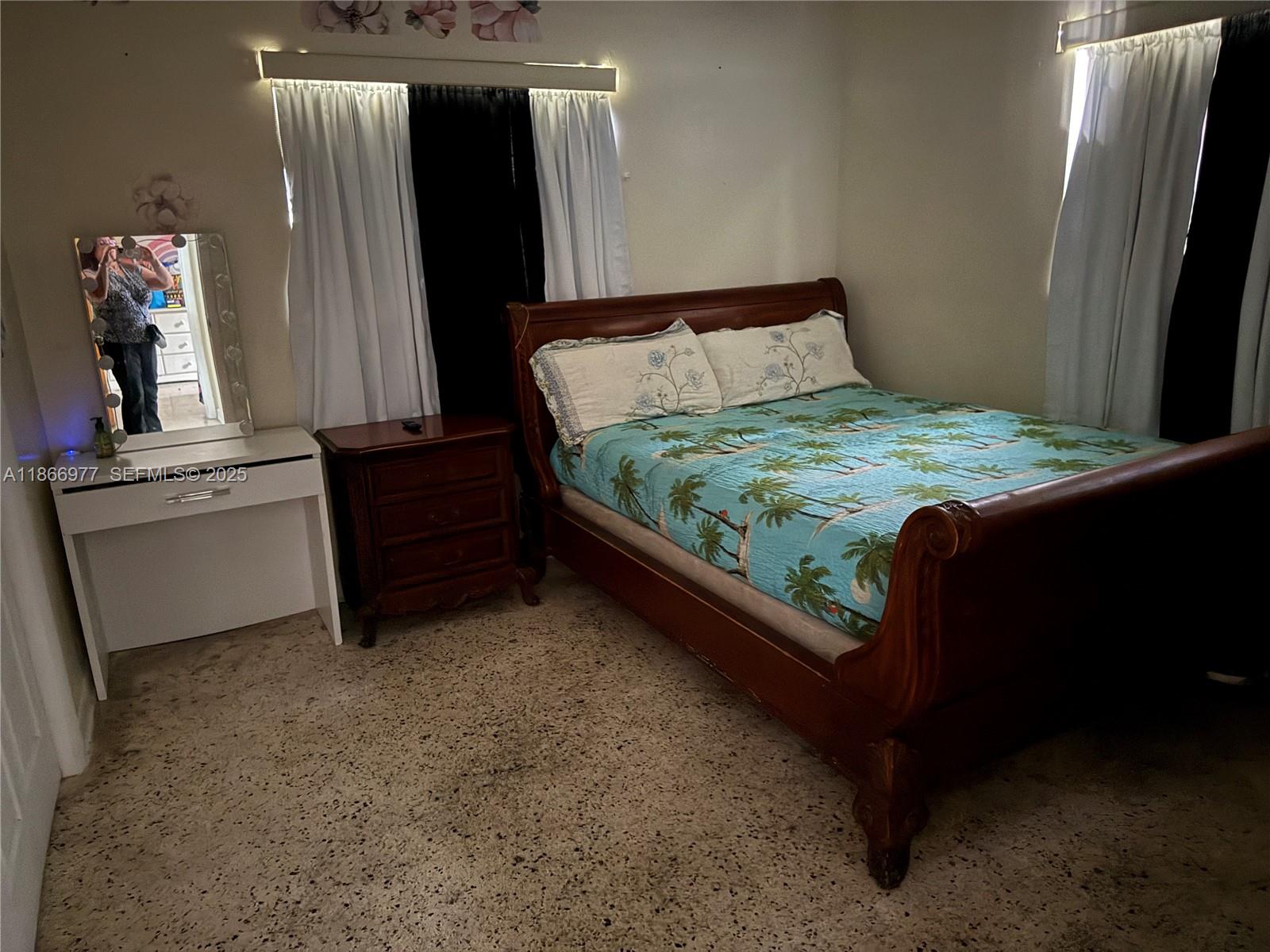 502 Southwest 13th Avenue Miami, FL 33135 - Photo 27 of 48 a bedroom with a bed and a dresser