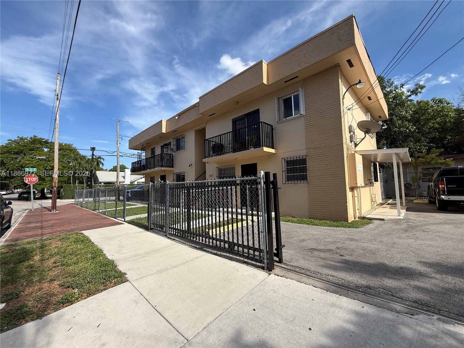 502 Southwest 13th Avenue Miami, FL 33135 - Photo 37 of 48 a view of a house with a patio and a yard