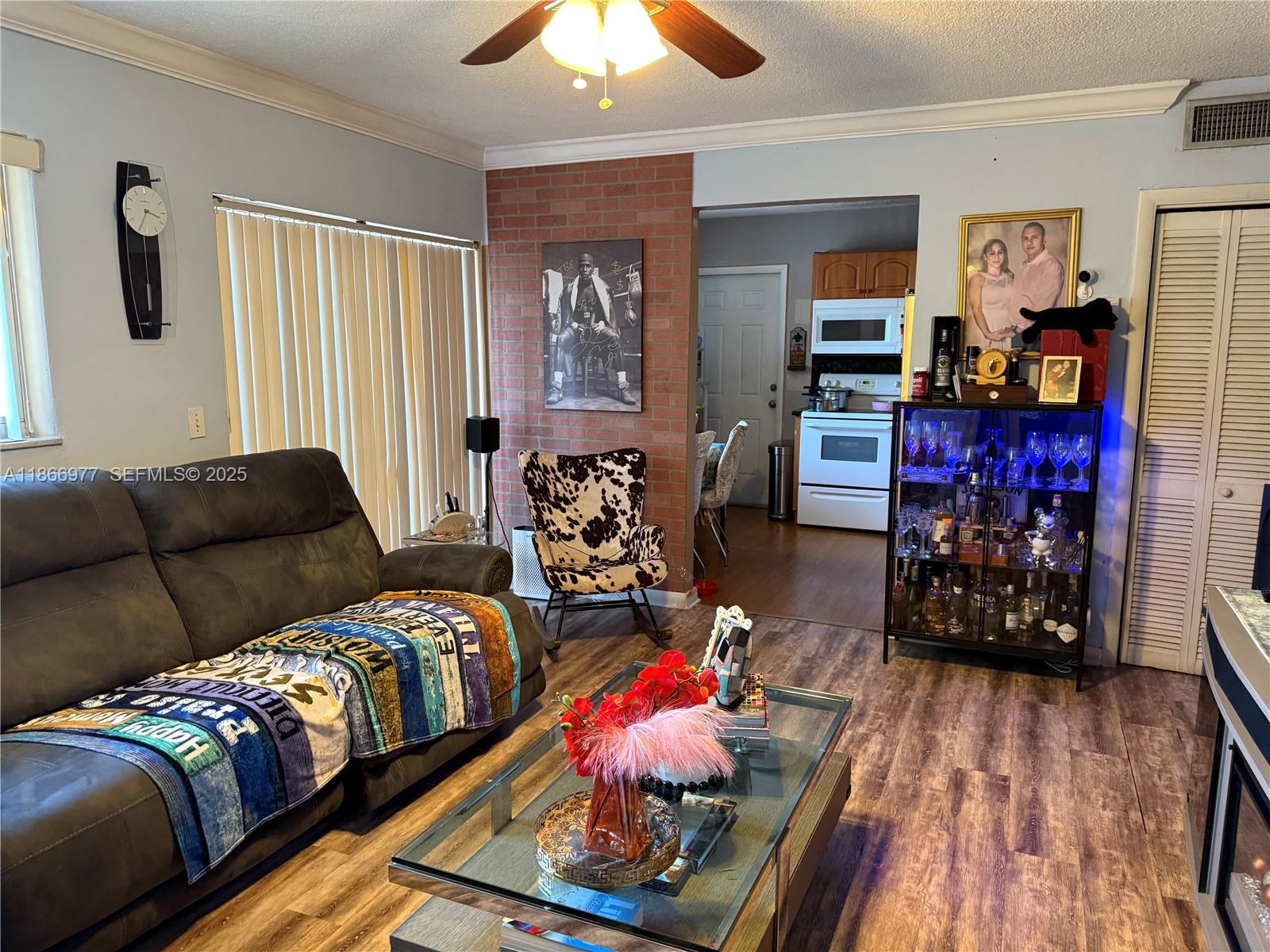 502 Southwest 13th Avenue Miami, FL 33135 - Photo 38 of 48 a living room with furniture and wooden floor