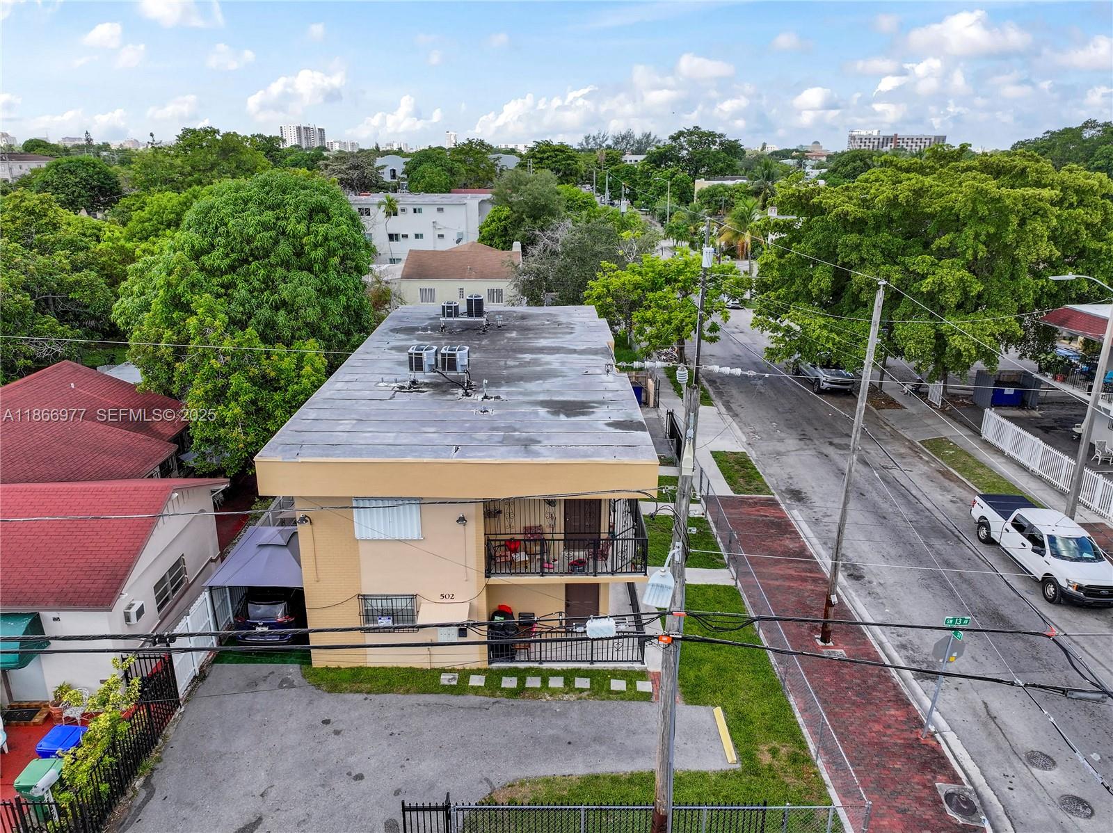 502 Southwest 13th Avenue Miami, FL 33135 - Photo 5 of 48 a front view of a house with a yard table and chairs