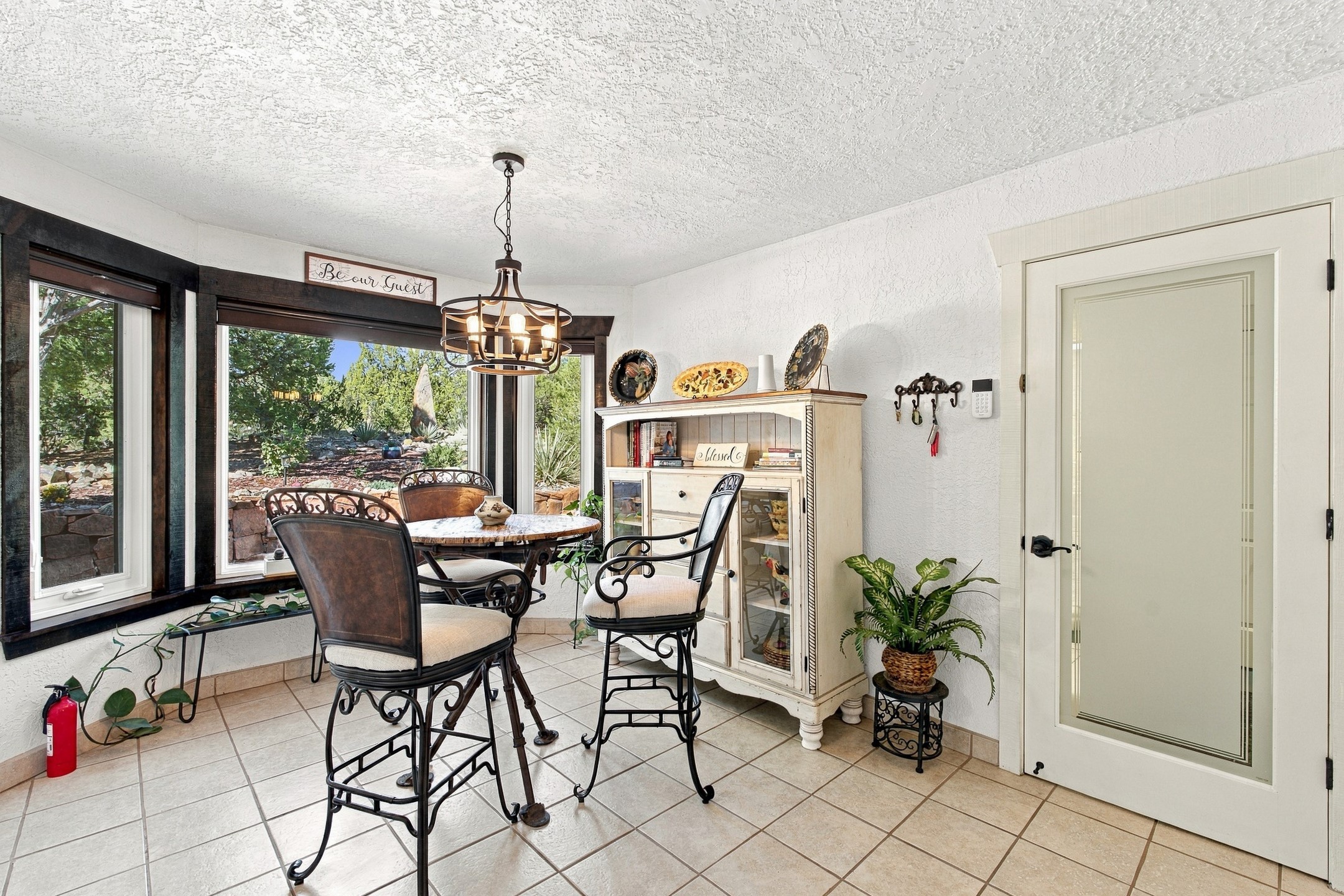 65 Puye Road Santa Fe, NM 87505 - Photo 21 of 62 Breakfast nook off kitchen. Door on right to laundry room and garage.