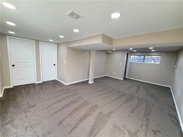 a bathroom with a shower and a toilet