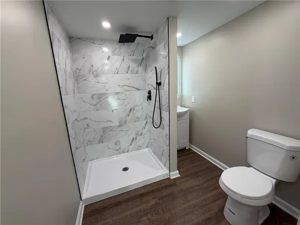 a bathroom with a bathtub and shower
