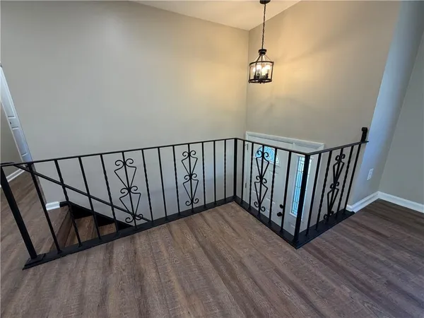 a view of a balcony with wooden floor