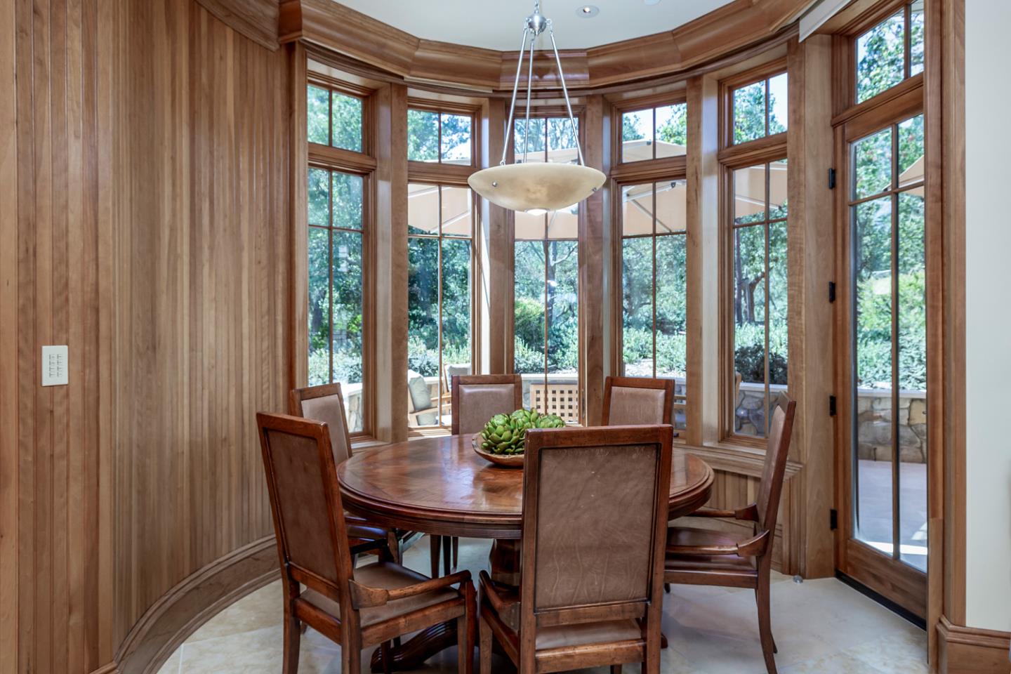 1 Redberry Ridge Portola Valley, CA 94028 - Photo 12 of 59 a view of a dining room with furniture large windows and wooden floor