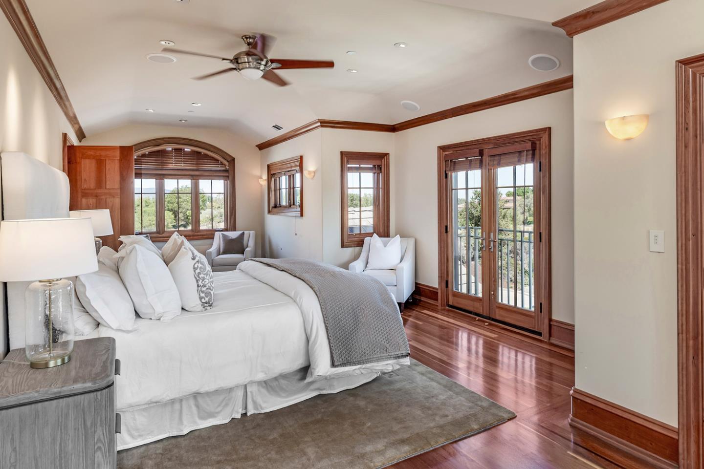 1 Redberry Ridge Portola Valley, CA 94028 - Photo 19 of 59 a bedroom with a balcony a bed and a chandelier