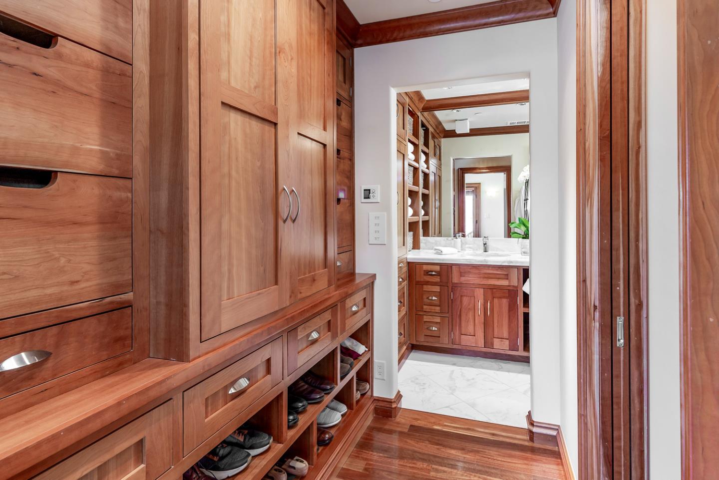 1 Redberry Ridge Portola Valley, CA 94028 - Photo 24 of 59 a bathroom with a vanity a sink a mirror and a shower
