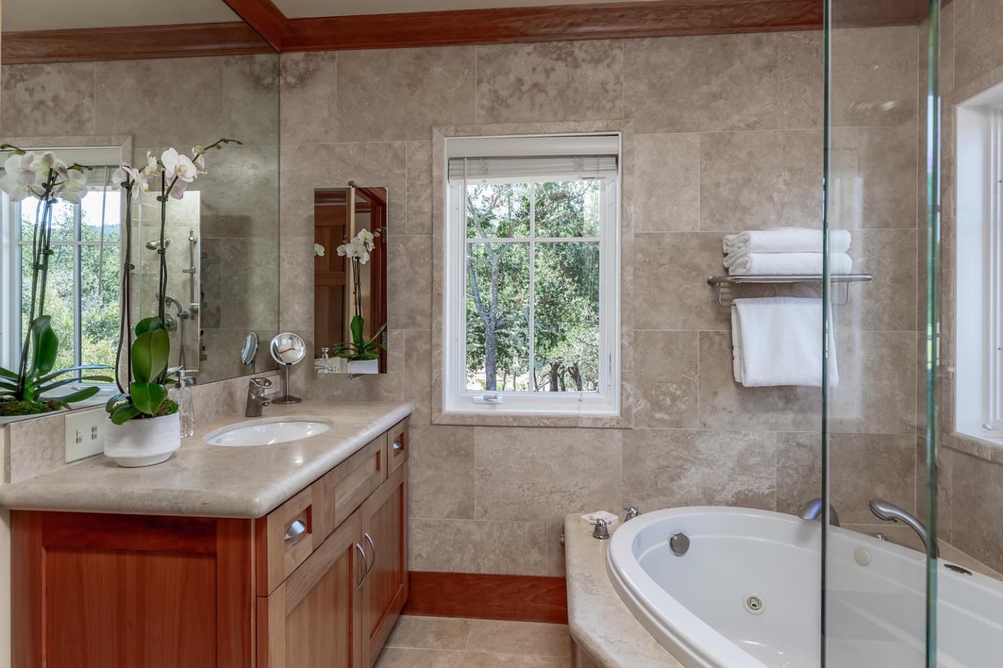 1 Redberry Ridge Portola Valley, CA 94028 - Photo 29 of 59 a bathroom with a granite countertop sink and a bathtub