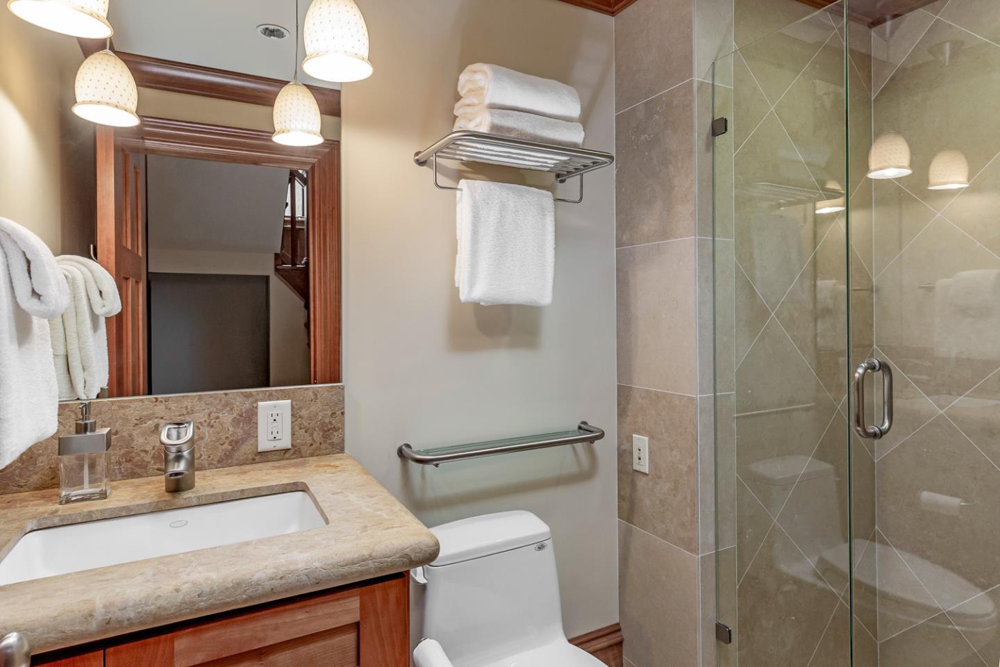 1 Redberry Ridge Portola Valley, CA 94028 - Photo 38 of 59 a bathroom with a granite countertop sink toilet and shower