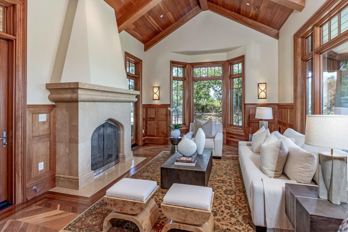 1 Redberry Ridge Portola Valley, CA 94028 - Photo 4 of 59 a living room with furniture a fireplace and a floor to ceiling window