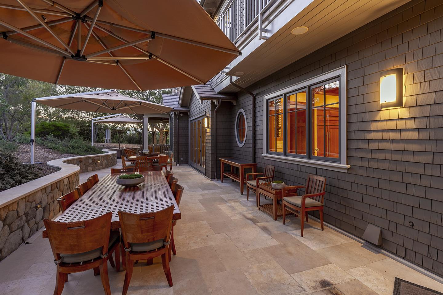 1 Redberry Ridge Portola Valley, CA 94028 - Photo 43 of 59 a view of a patio with table and chairs under an umbrella