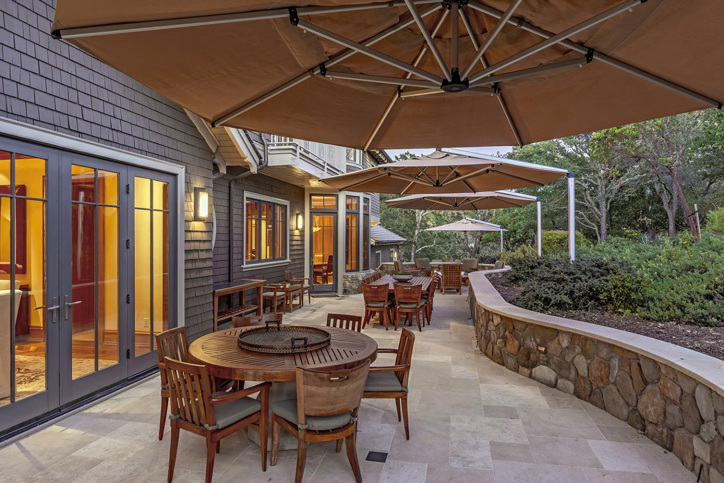 1 Redberry Ridge Portola Valley, CA 94028 - Photo 44 of 59 a patio with wooden floor a yard a table and chairs