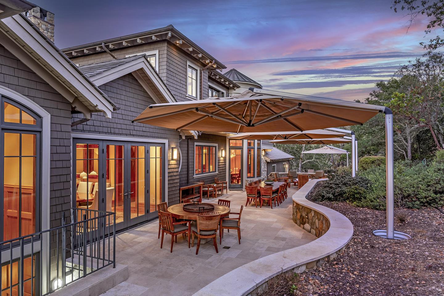 1 Redberry Ridge Portola Valley, CA 94028 - Photo 45 of 59 a view of a patio with table and chairs under an umbrella with a small yard