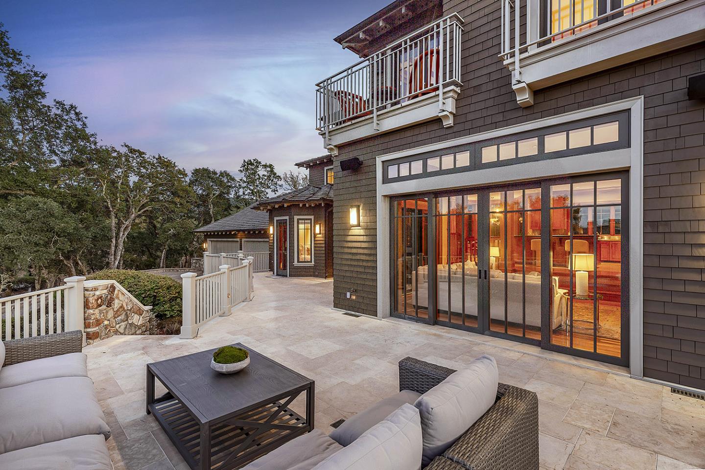 1 Redberry Ridge Portola Valley, CA 94028 - Photo 50 of 59 a view of a patio with couches table and chairs and wooden floor