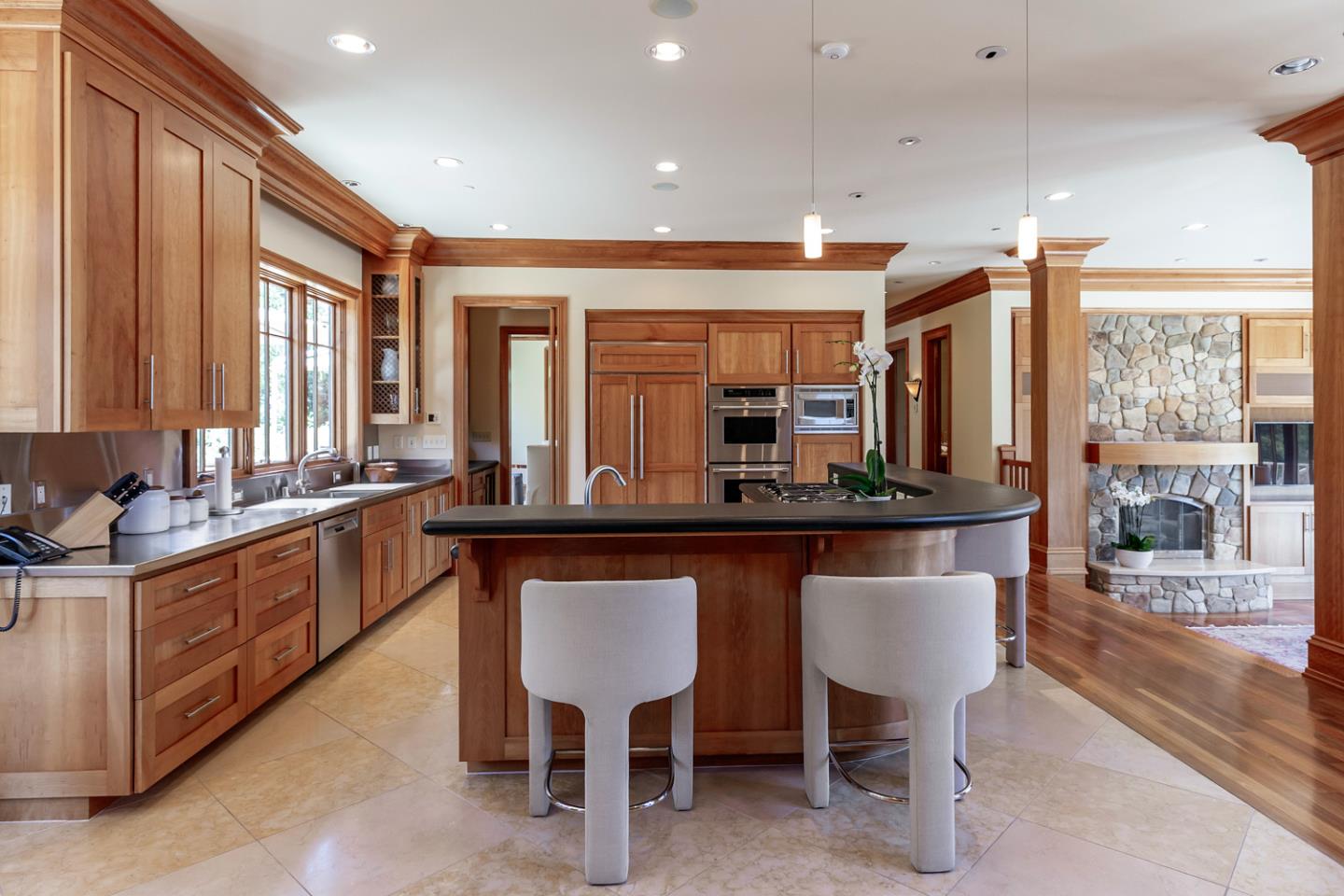1 Redberry Ridge Portola Valley, CA 94028 - Photo 8 of 59 a kitchen with counter top space dining table and chairs
