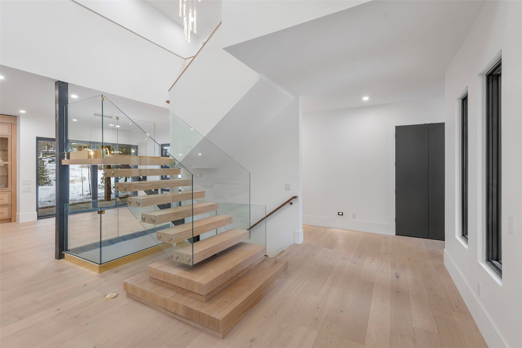 16 Wolf Rock Road Keystone, CO 80435 - Photo 14 of 40 Custom built stairs, with single metal stringer and glass siderails.