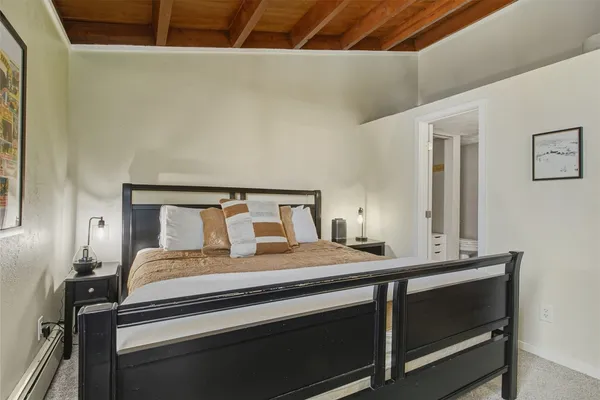 a bedroom with a bed and window