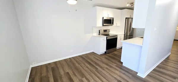 a view of kitchen and wooden floor